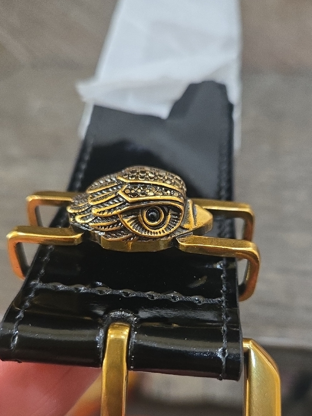 Kurt Geiger Black Patent Belt with Gold Eye Ornament